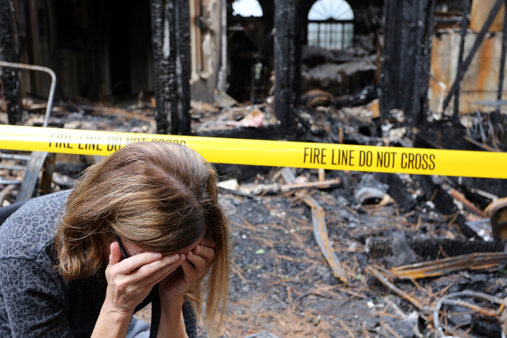 A,Woman,Is,Upset,About,What,Can,Be,Saved,From,Smoke,Damage,After,Her,House,Burned